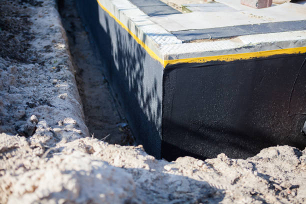 Professional Basement Waterproofing technician working in Hector, MN